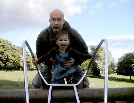 Natalie and Daddy playing on the slide