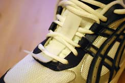Shoes with iStrap fitted under the laces